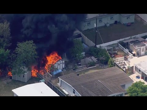 Fire rages in Hillsborough County neighborhood