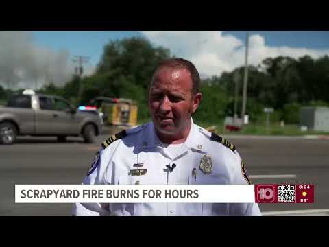 Hillsborough crews extinguishing hotspots at massive scrapyard fire that left 2 firefighters hurt