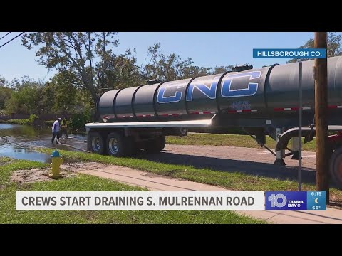 Crews start draining floodwaters South Mulrennan Road in Hillsborough County