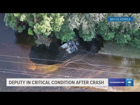 Pasco County deputy hospitalized after car overturns, submerges in water